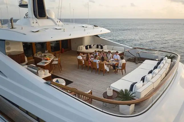 mediterranean-superyacht-charter-deck-guests-dining-alfresco-2026
