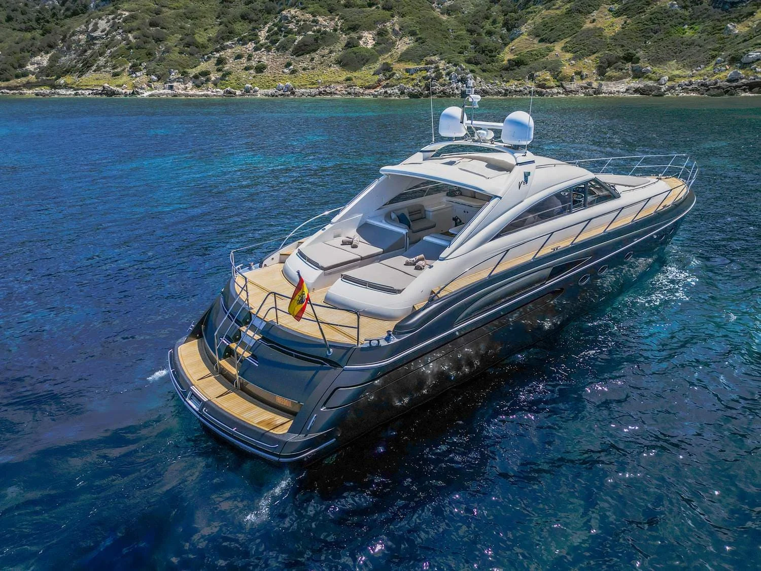 Yacht at anchor in Ibiza — anchoring is free and reduces APA costs