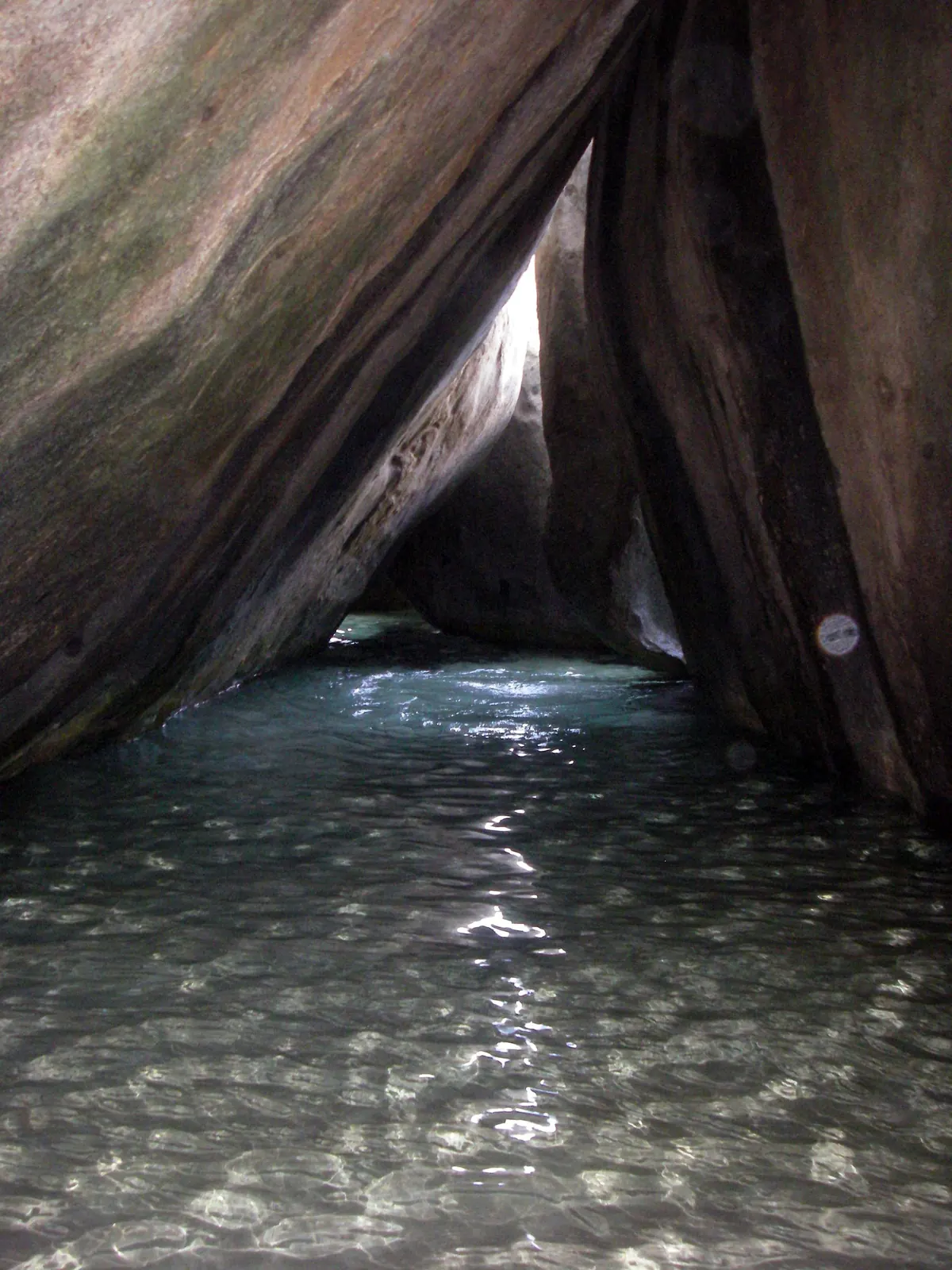 Seawater between granite boulders inside The Baths on Virgin Gorda.
